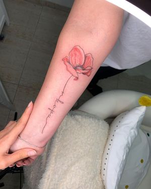 Delicate fine line flower with small lettering of name and quote by Alina Ivenko. Perfect for a subtle yet meaningful design.