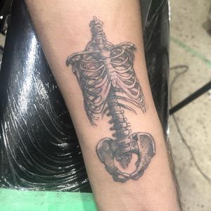 Get an edgy blackwork skeleton tattoo on your forearm by the talented artist Pablo. Stand out with this illustrative design.