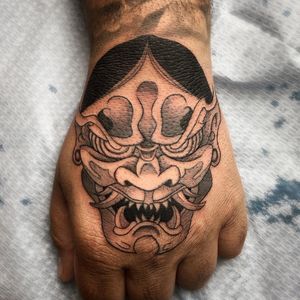 Experience the power of the Hannya mask with this striking Japanese design by Farhaad Khan on your hand.