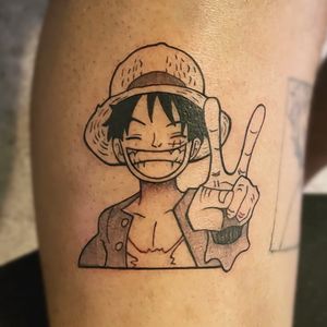 A bold blackwork tattoo featuring a man wearing a hat, inspired by Luffy's iconic style, by tattoo artist Farhaad Khan.
