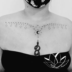 Ornamental crescent moon sternum tattoo