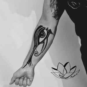 Eye of Horus tribal forearm tattoo