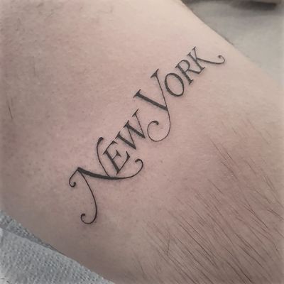 Capture the essence of New York with this small lettering tattoo on your arm. Perfect for anyone who loves the Big Apple!