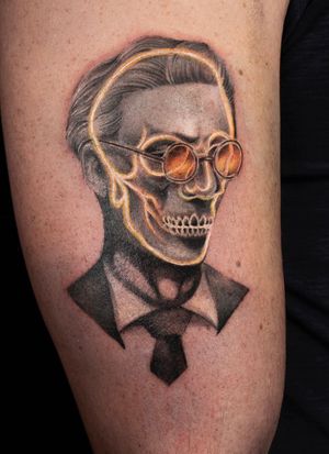 Illustrative black and gray tattoo on arm featuring a stylish man in a suit wearing glasses, by Mengni Yang.