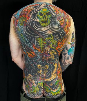 Get a bold and vibrant new school devil tattoo with intricate patterns on your back in London, GB.