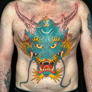 Experience the power and beauty of a traditional Japanese dragon tattoo by Stewart Robson on your chest.