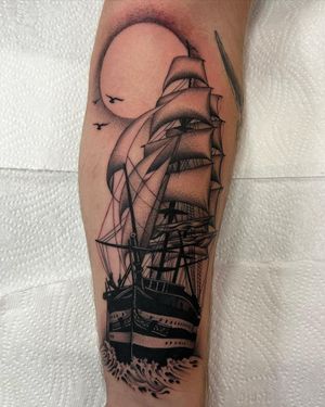 Captivating black and gray illustration of a moon and ship by Dani Mawby, perfect for your forearm.