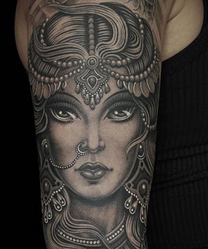 Get a stunning neo traditional tattoo of a woman on your arm in London, GB. Perfect mix of old-school charm and modern flair.