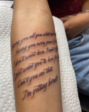 Fine line and small lettering tattoo on forearm with a meaningful quote design done by talented artist Carlos Hernandez.