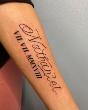 Get a fine line tattoo on your forearm featuring your name and favorite quote by renowned artist Carlos Hernandez.