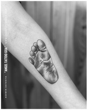 Baby Footprint Tattoo By @ashwin_tattooist At @angeltattoostudiogoa - Best Tattoo Artist in Goa- Best Tattoo Studio in Goa••𝐅𝐨𝐥𝐥𝐨𝐰 𝐅𝐨𝐫 𝐌𝐨𝐫𝐞 ⤵️@angeltattoostudiogoa ••𝐁𝐞𝐬𝐭 𝐐𝐮𝐚𝐥𝐢𝐭𝐲 𝐏𝐫𝐨𝐝𝐮𝐜𝐭𝐬 𝐔𝐬𝐢𝐧𝐠 ⤵️@kingstattoosupply @dynamiccolor @worldfamousink @kwadron @dermalizepro @cheyenne_tattooequipment ••𝐂𝐨𝐧𝐭𝐚𝐜𝐭 𝐅𝐨𝐫 𝐁𝐨𝐨𝐤𝐢𝐧𝐠 ☎️𝟗𝟗𝟔𝟎𝟏𝟎𝟕𝟕𝟕𝟓 | 𝟗𝟖𝟑𝟒𝟖𝟕𝟎𝟕𝟎𝟏••𝐎𝐟𝐟𝐢𝐜𝐢𝐚𝐥 𝐖𝐞𝐛𝐬𝐢𝐭𝐞 🌐www.angeltattoogoa.com