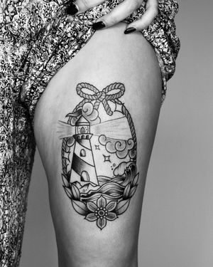 Blackwork upper leg tattoo by Marcos featuring a beautiful flower, ship, and intricate rope design.