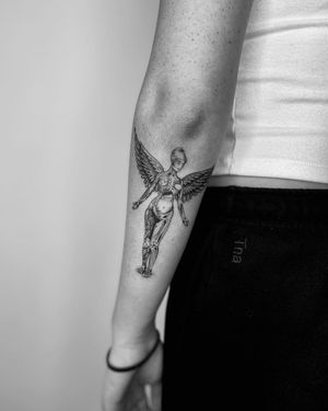 Beautiful blackwork tattoo on the forearm, featuring a woman with wings. Created by the talented Marcos.