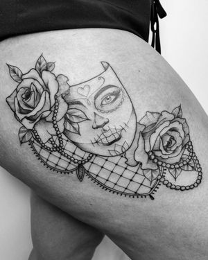 Intricate blackwork illustration on upper leg by Marcos featuring a stunning combination of a flower, mask, and pearls.