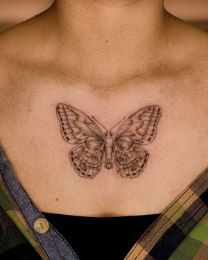 Fabian Lopez Barreda's blackwork butterfly tattoo on chest is a stunning piece of art, blending beauty and boldness.