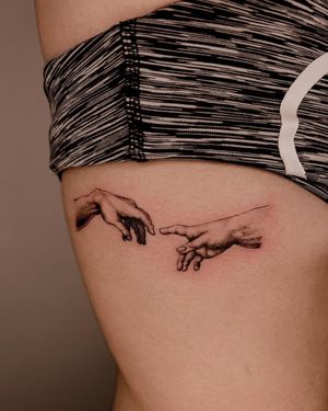 Get a stunning blackwork hand tattoo by Fabian Lopez Barreda for a unique and eye-catching design on your ribs.