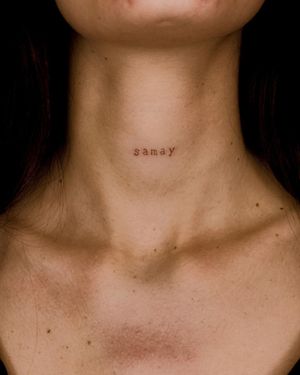 Elegant fine line and small lettering tattoo on neck featuring a meaningful quote by Fabian Lopez Barreda.