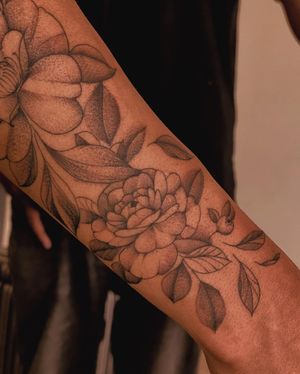Stunning blackwork flower tattoo by Fabian Lopez Barreda, perfect for your forearm. Detailed and eye-catching design.