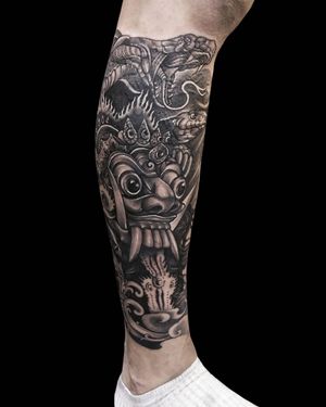 Capture the essence of Hindu mythology with this stunning black & gray lower leg tattoo by the talented artist Avi.