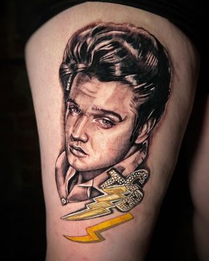 Get a stunning and realistic Elvis Presley lettering tattoo on your upper leg by tattoo artist Michaelle Fiore.