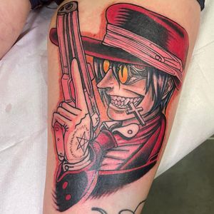 Showcase your love for Alucard with this detailed tattoo on your upper leg. Features a gun, cross, hat, glasses, and pentagram by artist Michaelle Fiore.