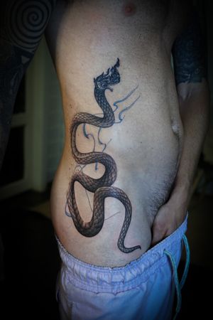 𝙄𝙂: 𝙣𝙖𝙩𝙚_𝙩𝙝𝙖𝙞𝙡𝙖𝙣𝙙 🌿 Blackwork Thai Naga tattoo by a Thai tattoo artist in Chiang Mai, Thailand