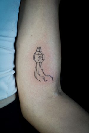 𝙄𝙂: 𝙣𝙖𝙩𝙚_𝙩𝙝𝙖𝙞𝙡𝙖𝙣𝙙 🌿 Fine line minimal Thai lantern tattoo by a Thai tattoo artist in Chiang Mai