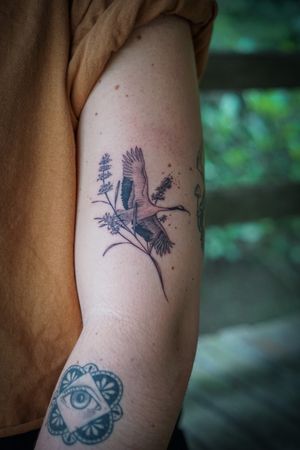 𝙄𝙂: 𝙣𝙖𝙩𝙚_𝙩𝙝𝙖𝙞𝙡𝙖𝙣𝙙 🌿 Blackwork crane bird tattoo with lavender flower by a Thai tattooist in Chiang Mai