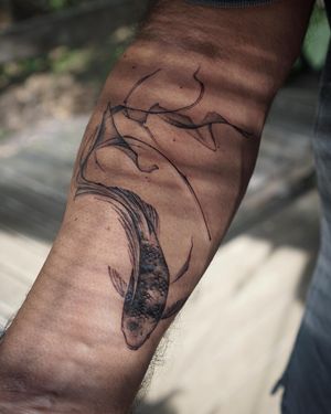 𝙄𝙂: 𝙣𝙖𝙩𝙚_𝙩𝙝𝙖𝙞𝙡𝙖𝙣𝙙 🌿 Blackwork flowing Koi fish tattoo by a Thai tattoo artist in Chiang Mai, Thailand