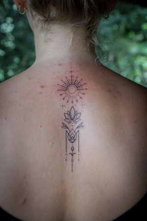 𝙄𝙂: 𝙣𝙖𝙩𝙚_𝙩𝙝𝙖𝙞𝙡𝙖𝙣𝙙 🌿 Fine line Thai lotus and sun tattoo by a tattooer at Baan Khagee Tattoo Chiang Mai, Thailand