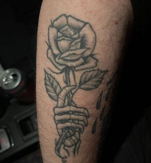 Skelton hand holding rose 