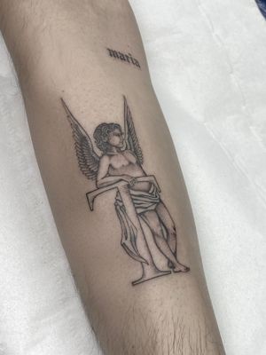A delicate and elegant forearm tattoo featuring an angel and letter design by talented artist Sophie Rose Hunter.
