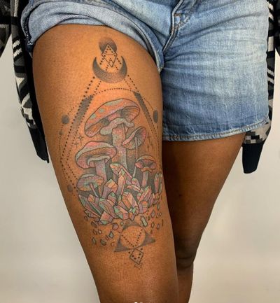 Experience the magic of dotwork and illustration with this unique crystal and mushroom design by artist Karen Buckley on the upper leg.