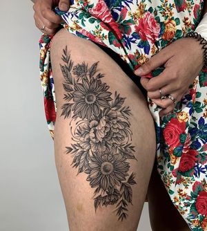 Beautifully detailed dotwork floral design by Karen Buckley, perfect for upper leg placement.