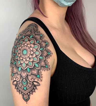 Elegant dotwork mandala design by Karen Buckley, perfect for a shoulder placement.