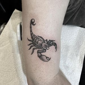 Get a bold and intricate scorpion design on your upper arm in black and gray traditional style by tattoo artist Federico Colantoni.