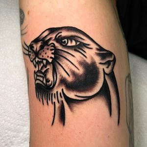 Get a fierce traditional panther tattoo on your arm by the talented artist Alessandro Lanzafame. Perfect for those who seek strength and power in their ink.