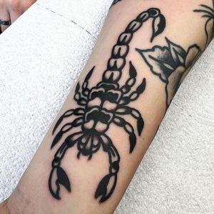 Get a fierce and timeless scorpion tattoo on your forearm by the talented artist Alessandro Lanzafame.