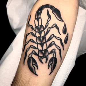 Capture the strength and protection of a scorpion with this bold traditional style forearm tattoo by Alessandro Lanzafame.