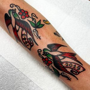 Forearm tattoo featuring a classic traditional style bird with the year incorporated, designed by Alessandro Lanzafame.