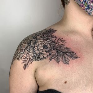 Beautifully detailed flower design by Karen Buckley, perfect for the shoulder, created using intricate dotwork technique.