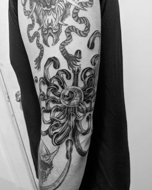 Adorn your arm with a beautiful blackwork flower design expertly inked by the talented artist Shane.
