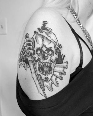Immerse yourself in Shane's unique blackwork and illustrative style with this edgy tattoo featuring a skull, knife, and clown motif.