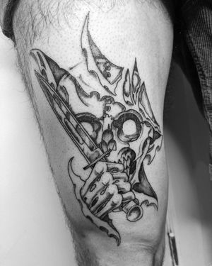 Get inked with a badass blackwork illustrative design featuring a skull and knife by artist Shane on your upper leg.