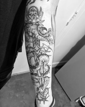 Bold blackwork forearm tattoo featuring a snake, flower, and sword design by Shane, with illustrative style.