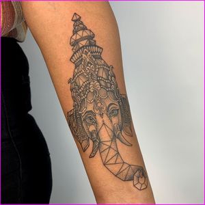 Adorn your forearm with Karen Buckley's intricate dotwork design featuring a majestic geometric elephant motif.