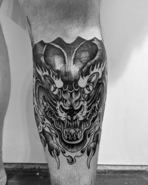 Experience Shane's expert blackwork style with this fierce dragon motif on your lower leg. Stand out with this unique and powerful tattoo.