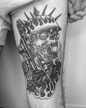 Pay homage to bravery with this illustrative gun, soldier, and helmet design on your upper leg by Shane.