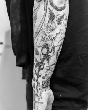 Get a stunning blackwork flower tattoo on your forearm by the talented artist Shane. Elevate your style with this unique piece.
