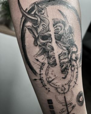 Get a bold blackwork hannya mask with intricate patterns on your forearm by Lawrence.